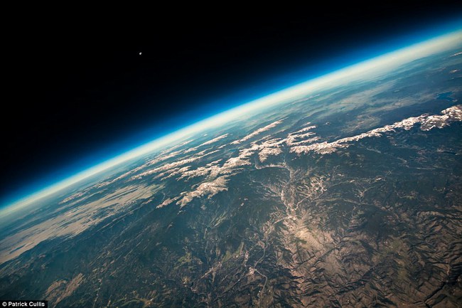 Earth blue horizons and the panoramic view of the Rocky Mountains, recorded in high-altitude balloon, which originated in Boulder (Colorado, USA)
